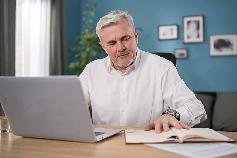 Senior Man Checking Home Finances Using A Computer